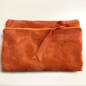 Faux fur fold over zip clutch